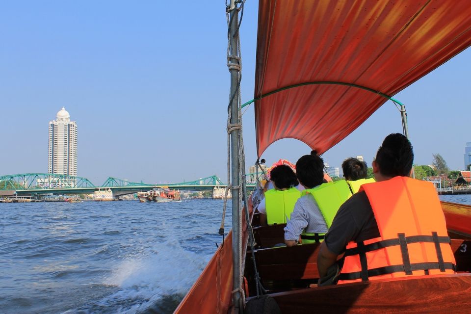 Bangkok: 2-Hour Canal Tour by Teak Boat - Temple stops and small moments: catfish feeding, fruit boats, and wildlife