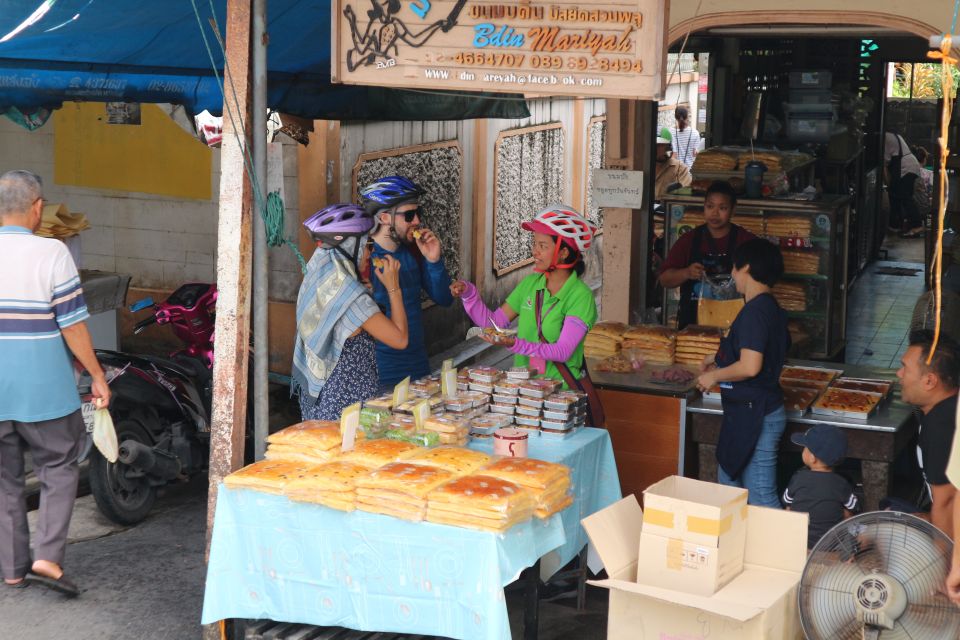 Bangkok: Bike and Canal Boat Tour with Lunch - Thonburi bike time: alleys, market smells, and temple stops