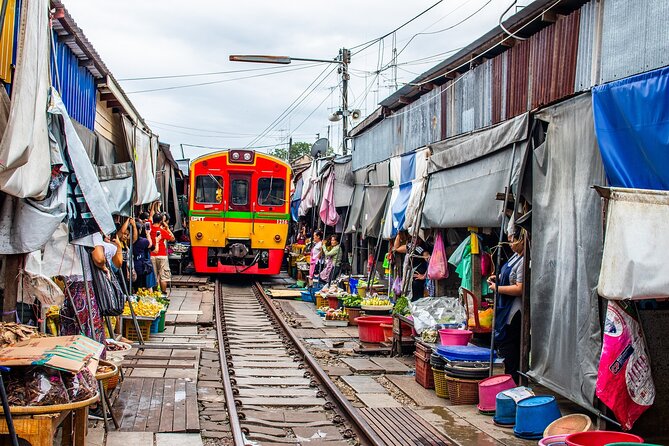 Damnoen Saduak Floating Market and Maeklong Railway Market Tour - Damnoen Saduak Floating Market: boat canals, then shopping in a tourist-famous place