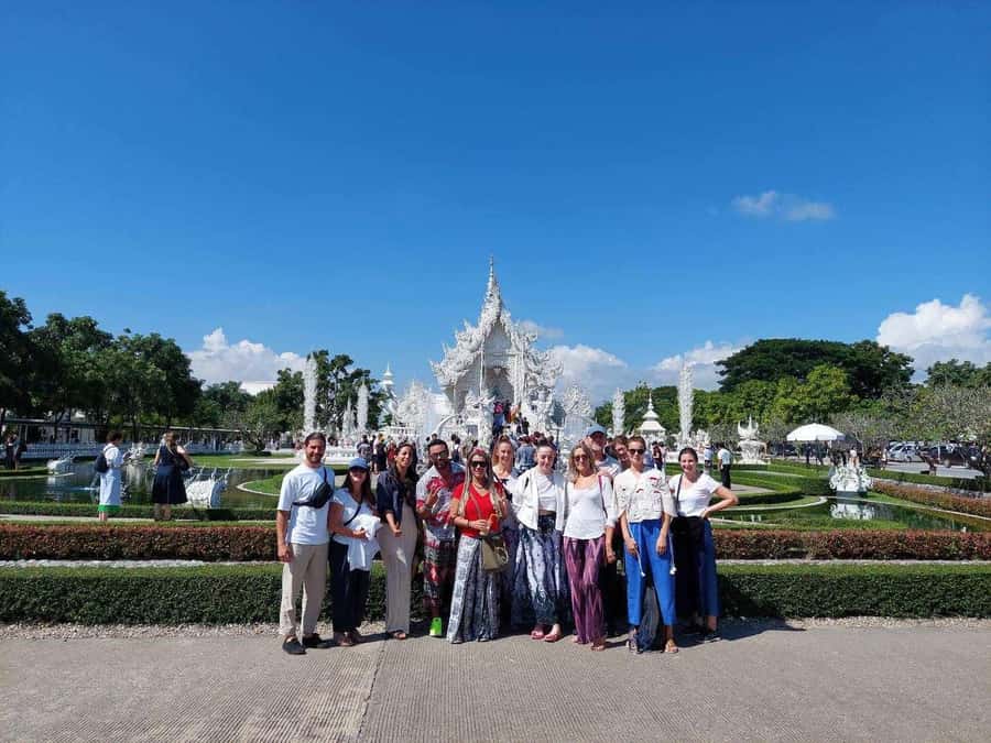 From Chiang Mai: Chiang Rai Temples and Golden Triangle Tour - Wat Rong Khun White Temple: reflections, details, and shoe rules