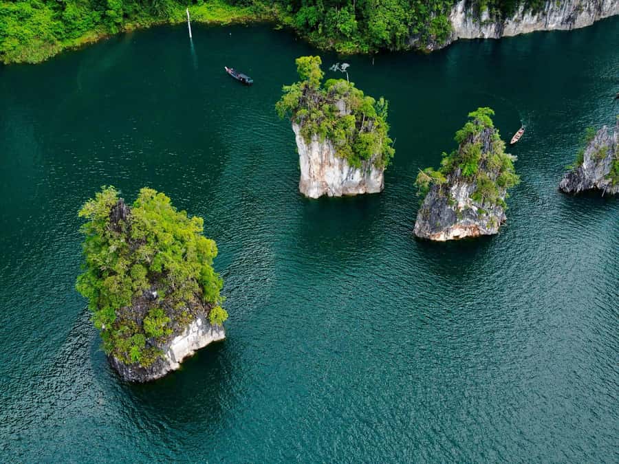 From Khao Lak/Khao Sok: Cheow Lan Lake and Emerald Pool Tour - Cheow Lan Lake by Boat: Three Brothers and the Floating-Rainforest Feeling