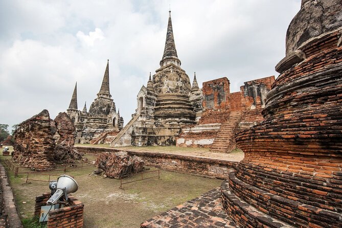 Lopburi Monkey Temple & Ayutthaya Old City Tour From Bangkok - Stop 4: Wat Mahathat and the tree-root famous Buddha image