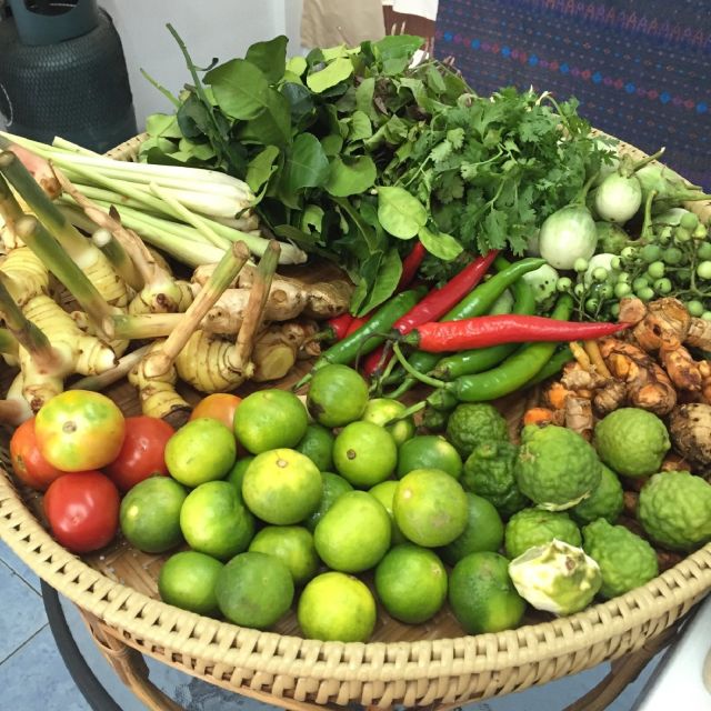 Phuket: Half Day Easy Thai Cooking Class & Local Market Tour - Kitchen garden moment: fresh ingredients in a small, serious space