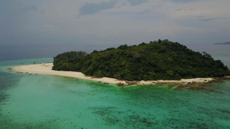 Phuket: Phi Phi Sunrise Boat Tour to Bamboo and Khai Island - Bamboo Island: beach time plus one last snorkeling chance