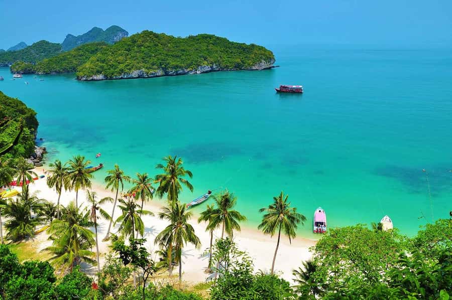 Samui: Angthong Marine Park Boat Tour w/ Transfer and Meals - Kayaking option: paddling near limestone walls where the water looks unreal